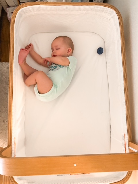 Baby sleeping in Cradlewise smart crib