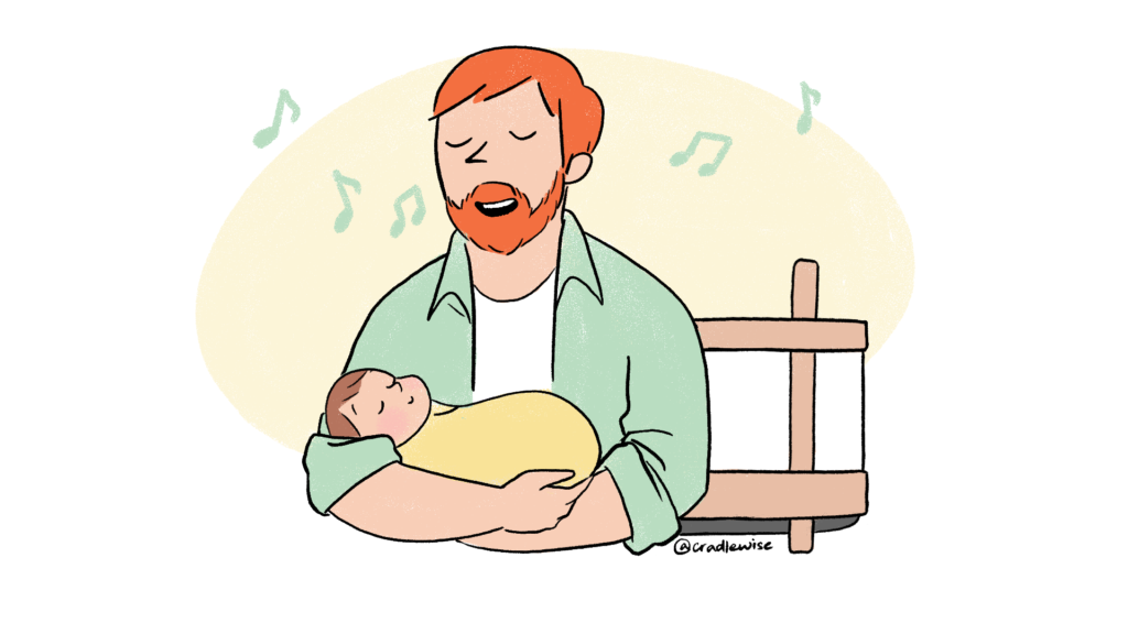 A dad singing to his baby